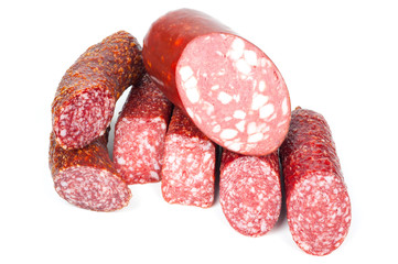 Smoked sausage in assortment on a white background