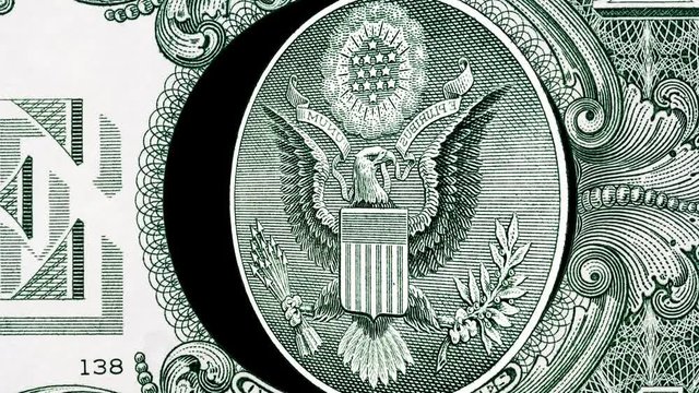 Creative 4k parallax video details of a 1 american dollar banknote with a rotating eagle close-up. One US dollar bill macro view.