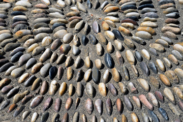 Close up of Park sidewalk paved with pebbles