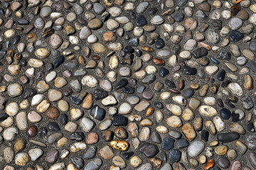 Close up of Park sidewalk paved with pebbles