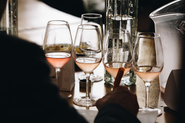 White, red and rose wine tasting close up view. Drop wine carafe.