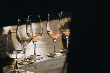 White, red and rose wine tasting close up view. Drop wine carafe.