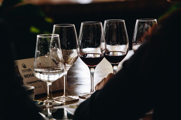 White, red and rose wine tasting close up view. Drop wine carafe.