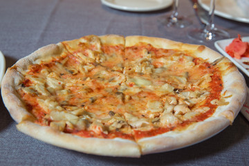 italian style pepperoni pizza with mushrooms . fried potatoes. ketchup