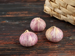 Fresh garlic on market table closeup photo