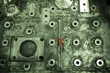 Top view, close-up of metallurgical equipment. Fragment of a continuous steel casting machine. Abstract background. Heavy engineering, repair of metallurgical equipment