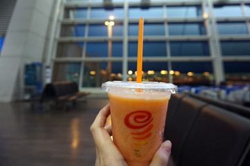Incheon, South Korea - 10th March 2019 : Jamba Juice, holding by hand at the international airport...
