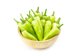 sweet pepper in wooden bowl isolated on white background