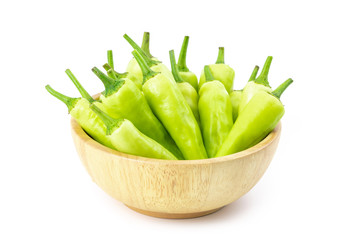 sweet pepper in wooden bowl isolated on white background