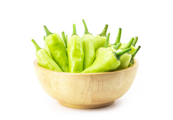 sweet pepper in wooden bowl isolated on white background