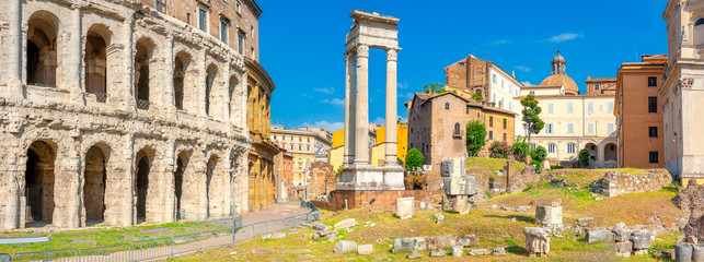 Antique architecture of Rome. Panorama of the Roman amphitheater and columns on the ancient ruins. above famous architectural landmark.