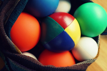 Close up of colorful different juggling balls in a bag
