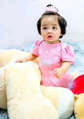 cute baby girl in a pink dress