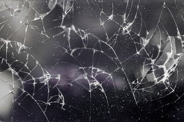 Cracked smart phone screen close-up.