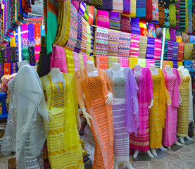 Traditional Asian Burmese dresses and fabrics on display