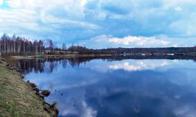 the view of the calm lake, the blue sky