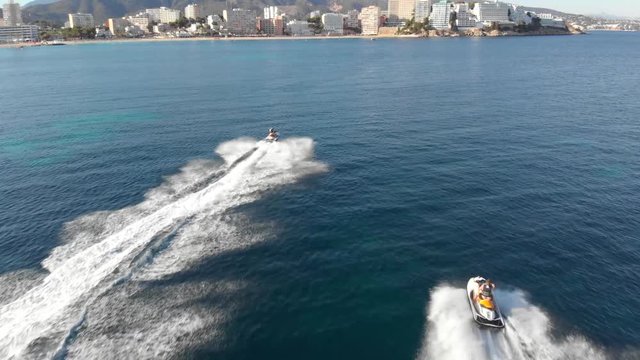 Jetskis chased by a drone