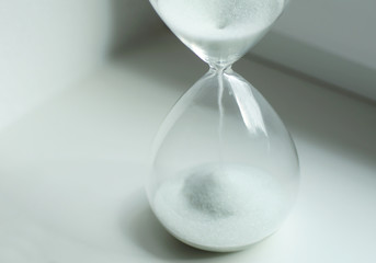 Close up of a hourglass symbolizing running time