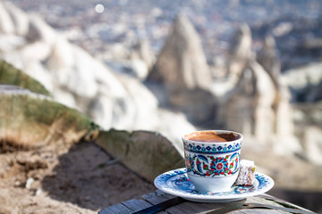 Cup with traditional Turkish coffee on a background of a valley in Cappadocia, Turkey