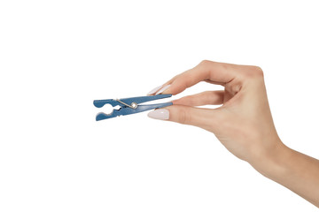 the female hand holds a clothespeg is isolated on a white background