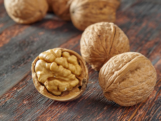 Walnuts lie on a light colored background