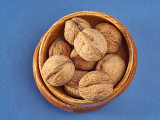 Walnuts lie on a light colored background