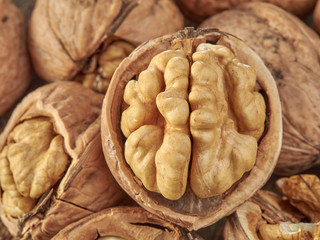 Walnuts lie on a light colored background