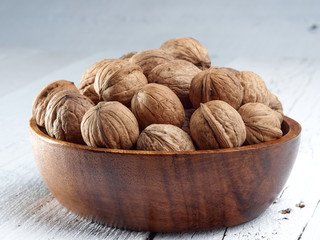 Walnuts lie on a light colored background