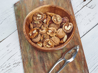 Walnuts lie on a light colored background