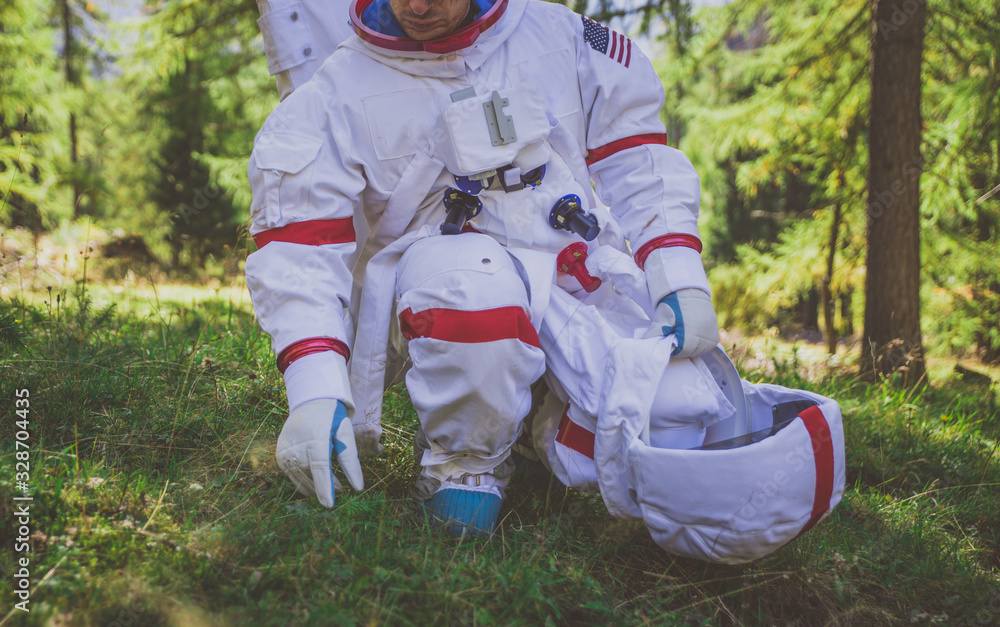 Poster astronaut exploring a new planet. searching for a new home for humanity. concept about science and n