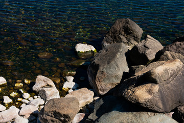 Big rocks on a Nahuel Huapi Lake beach. Bariloche, Argentina