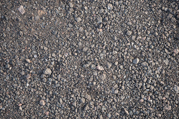Background image of the surface of a gravel walking path