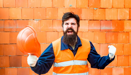 Success. Successful builder shows a gesture of success. Happy owner of the construction business....