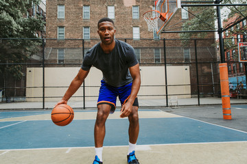 Basketball player training on a court in New york city © oneinchpunch