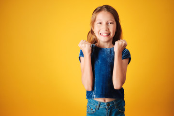 Little Redhead Girl Jumping For Joy And Happiness