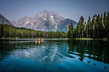 kayaking a mountain lake - Powered by Adobe