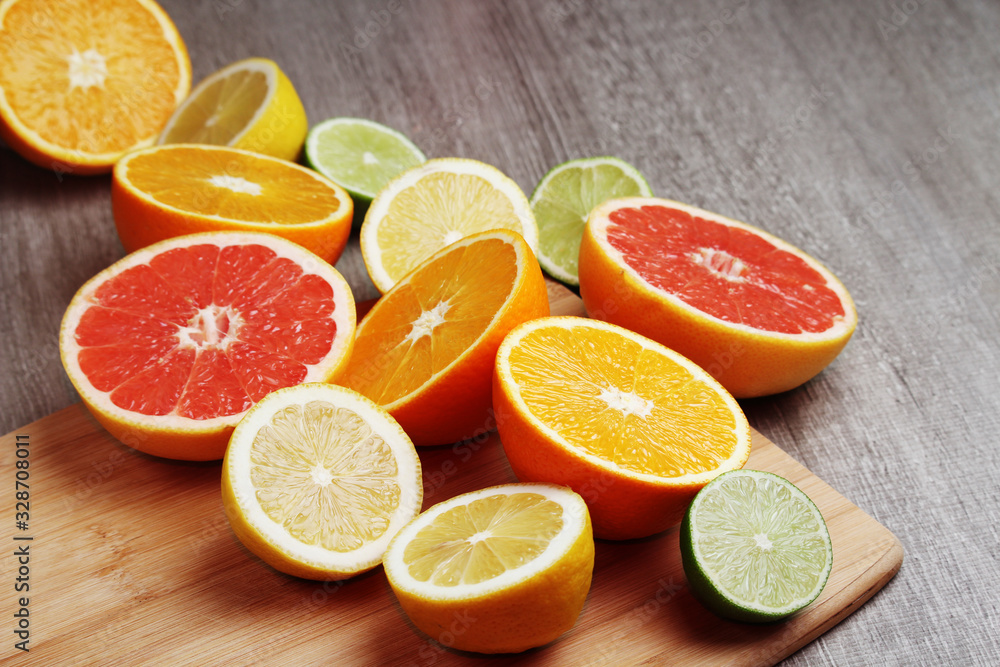 Poster Mix of citrus fruits cut in different forms	