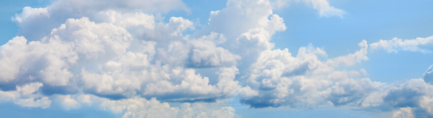 Blue sky with fluffy clouds. Beautiful sky clouds background