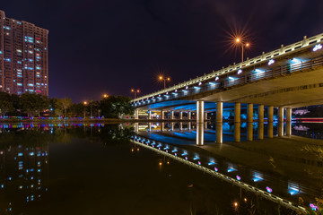 A bridge of decorative lights in the night