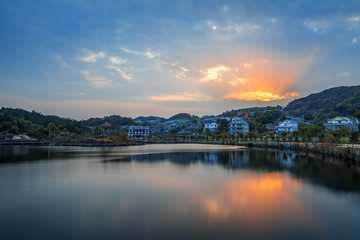 Artificial lakes, pavilions and running water in the setting sun