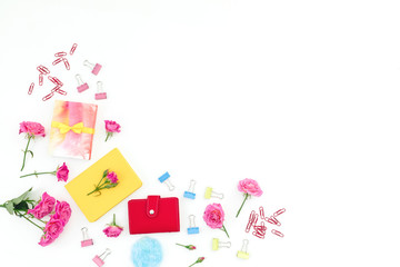 Conceptual frame with notebook, eucalyptus, gift and roses on white. Flat lay.