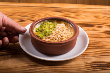 milk dessert with nuts  (sütlaç) in turkey