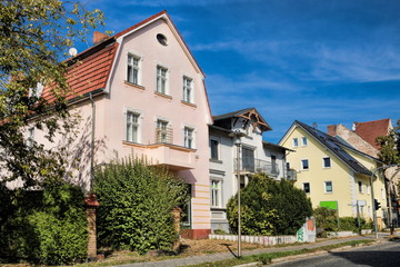 Fototapeta na wymiar eichwalde, germany - straße mit sanierten altbauten