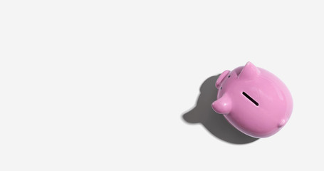 Pink piggy bank overhead view - flat lay