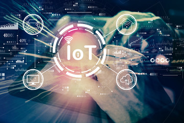 Obraz premium IoT theme with man using his tablet computer