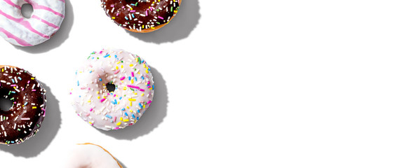 Collection of delicious donuts overhead view flat lay