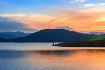 Like a mirror, the lake reflects the mountains and trees