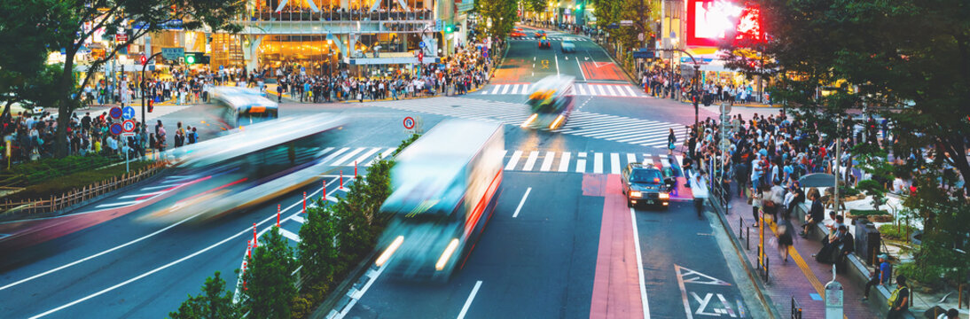 People Cross The Famous Intersection In Shibuya, Tokyo, Japan One Of The Busiest Crosswalks In The World.