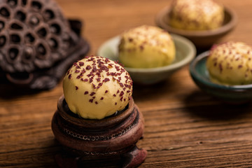 Egg yolk buns on a wooden table