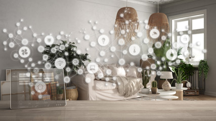 Tablet wireless with smart home app on wooden table, geometric background with connected line and dots showing internet of things system, home automation concept over living room